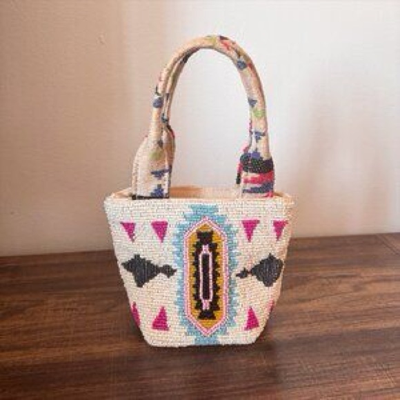 America and Beyond Handbags - America & Beyond Beaded Artistic Handbag with white and multicolor patterns.